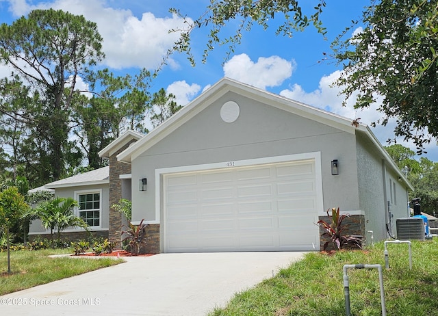 431 Falls Church St SW, Palm Bay, FL 32908 - ranch-style home featuring stone siding, driveway, a garage, and stucco siding