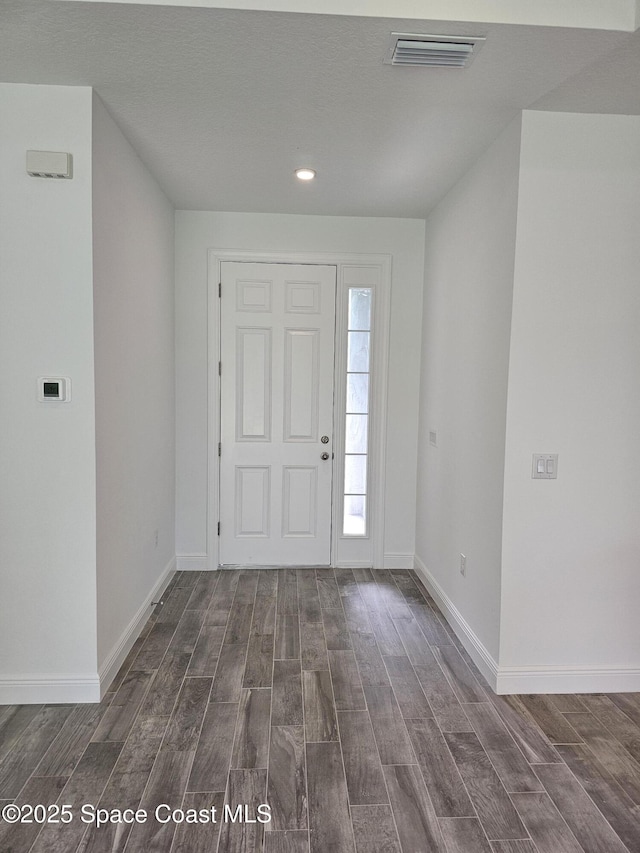 431 Falls Church St SW, Palm Bay, FL 32908 - entrance foyer featuring dark wood-style flooring and recessed lighting