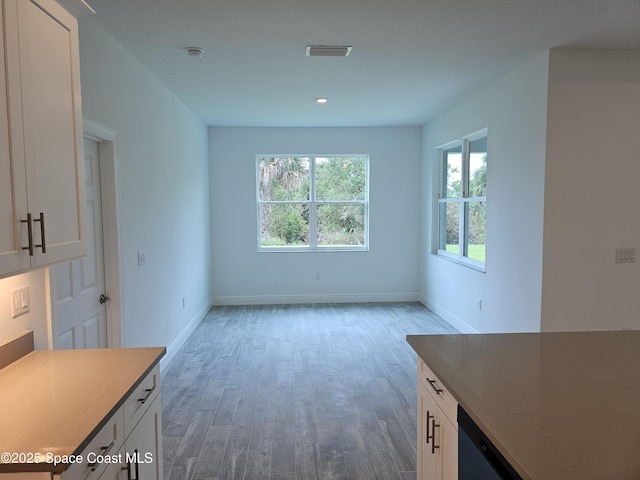 431 Falls Church St SW, Palm Bay, FL 32908 - unfurnished dining area with wood finished floors and recessed lighting