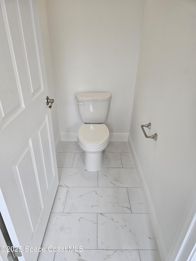 431 Falls Church St SW, Palm Bay, FL 32908 - bathroom featuring marble look tiles