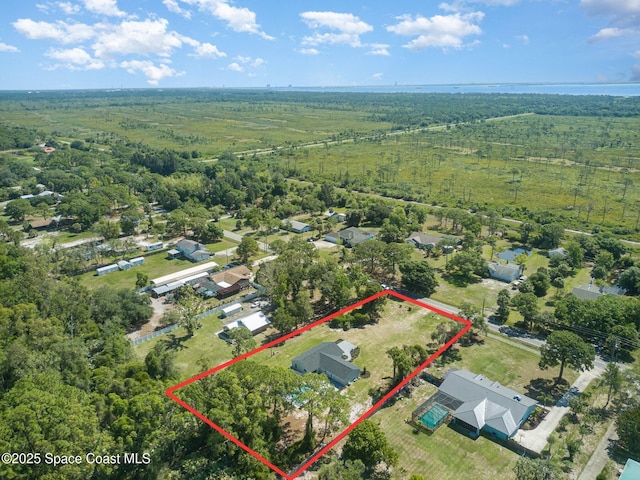 5695 Broad Acres St, Merritt Island, FL 32953 - aerial view of property and surrounding area with property parcel outlined and a forest