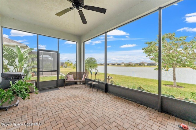 2889 Millennium Cir, Melbourne, FL 32940 - sunroom with a water view and ceiling fan