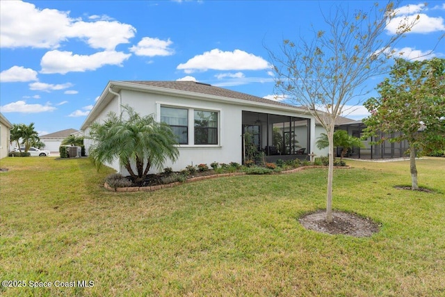 2889 Millennium Cir, Melbourne, FL 32940 - view of front of home featuring stucco siding, a front yard, a sunroom, and central air condition unit