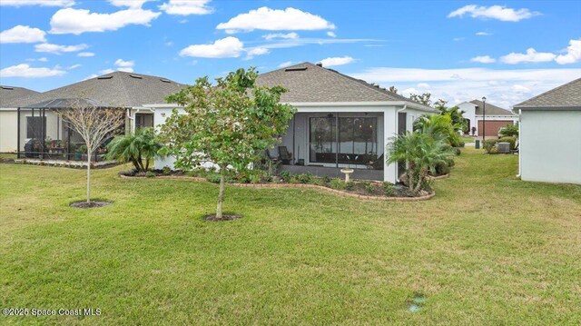 2889 Millennium Cir, Melbourne, FL 32940 - back of property featuring a yard, roof with shingles, and a lanai