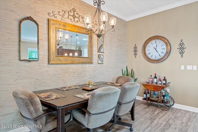 2889 Millennium Cir, Melbourne, FL 32940 - dining space featuring a chandelier, baseboards, wood finished floors, and crown molding