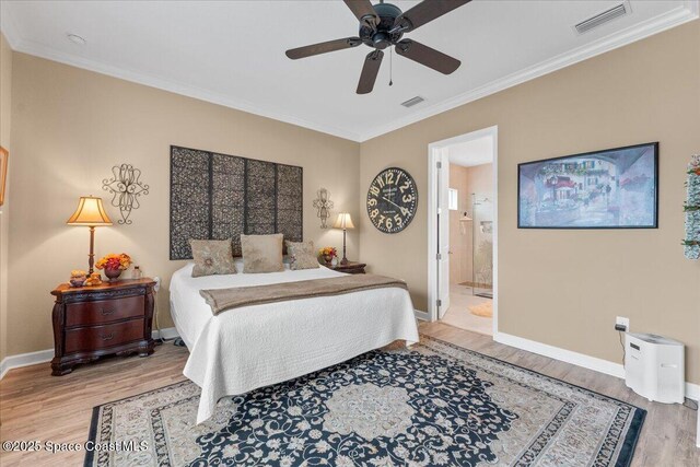 2889 Millennium Cir, Melbourne, FL 32940 - bedroom featuring light wood-style floors, ornamental molding, baseboards, ensuite bath, and a ceiling fan