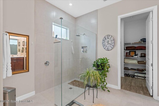 2889 Millennium Cir, Melbourne, FL 32940 - full bath with a walk in shower, baseboards, tile patterned floors, and recessed lighting