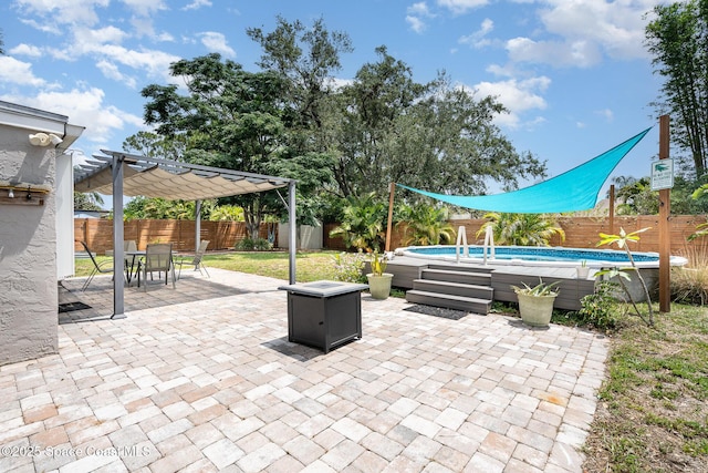 1035 Blau Ct NW, Palm Bay, FL 32907 - fenced backyard with a pergola, a patio, and outdoor dining space
