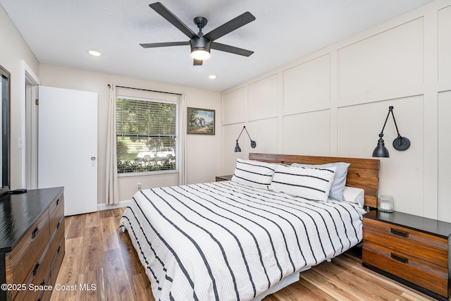 1035 Blau Ct NW, Palm Bay, FL 32907 - bedroom featuring light wood-type flooring, a decorative wall, recessed lighting, and ceiling fan