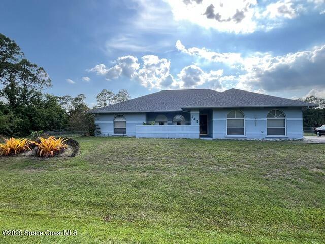 130 Nemo Cir NE, Palm Bay, FL 32907 - view of front of property featuring a front lawn