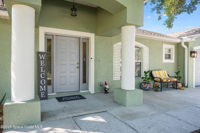 1317 Mohegan Ter SE, Palm Bay, FL 32909 - doorway to property with stucco siding