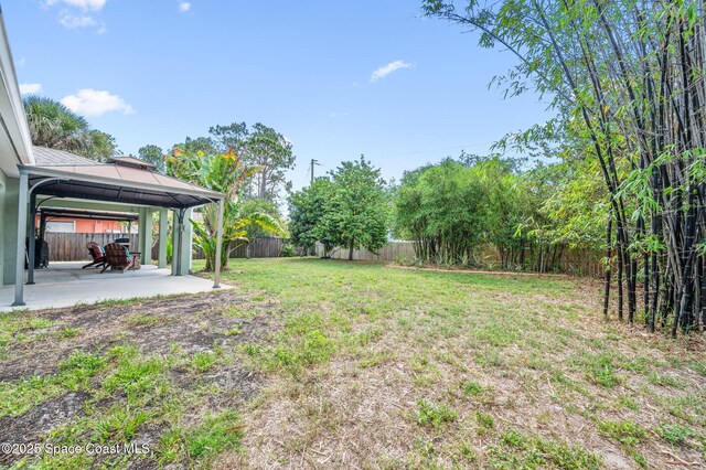 1317 Mohegan Ter SE, Palm Bay, FL 32909 - view of yard with a gazebo and a patio area