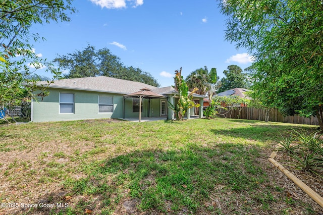 1317 Mohegan Ter SE, Palm Bay, FL 32909 - rear view of property featuring a gazebo and a patio area
