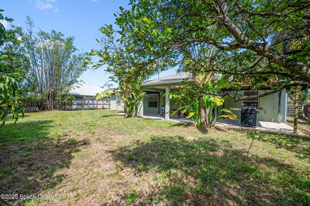 1317 Mohegan Ter SE, Palm Bay, FL 32909 - view of yard with a patio