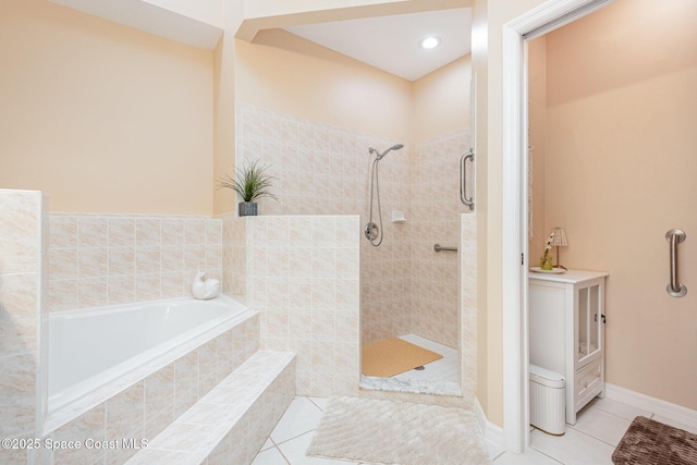 570 Shell Cove Dr, Melbourne, FL 32940 - full bathroom featuring tile patterned flooring, a bath, and a tile shower