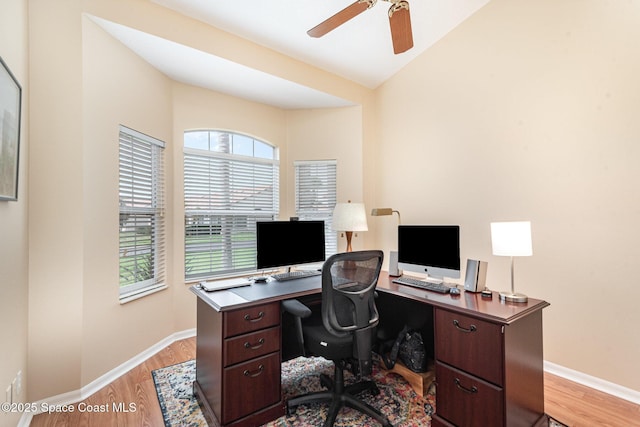570 Shell Cove Dr, Melbourne, FL 32940 - office with light wood-style flooring, ceiling fan, baseboards, and vaulted ceiling
