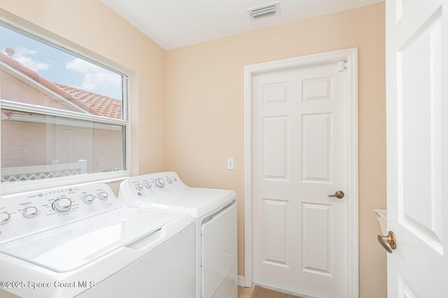 570 Shell Cove Dr, Melbourne, FL 32940 - laundry area featuring independent washer and dryer