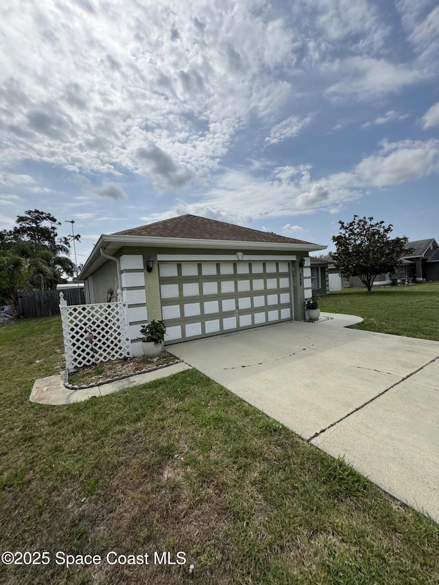 157 Lehigh Ave SE, Palm Bay, FL 32909 - view of side of home featuring an attached garage, driveway, and stucco siding