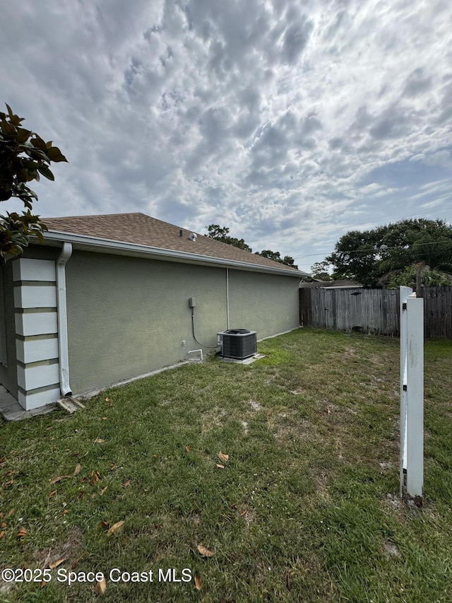 157 Lehigh Ave SE, Palm Bay, FL 32909 - view of yard featuring central air condition unit