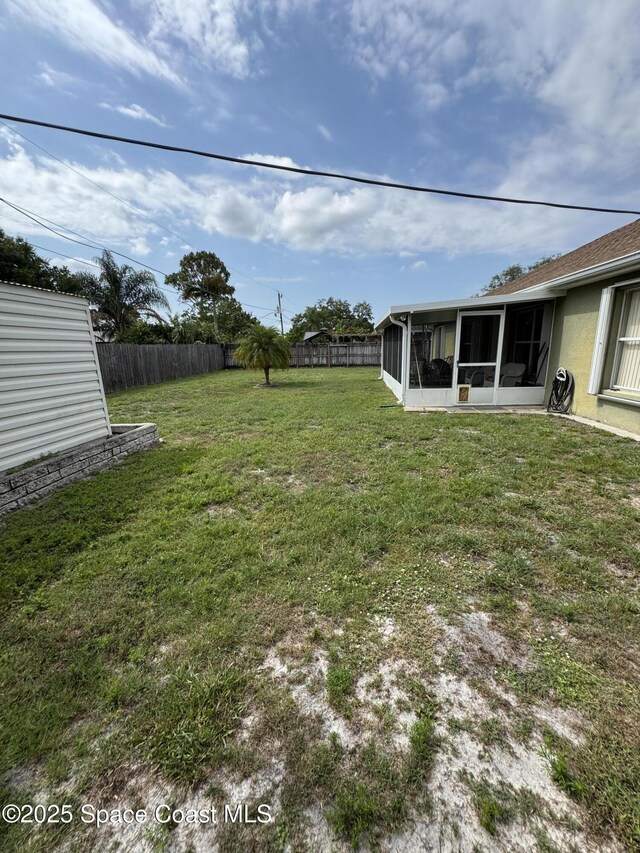 157 Lehigh Ave SE, Palm Bay, FL 32909 - view of yard with a sunroom