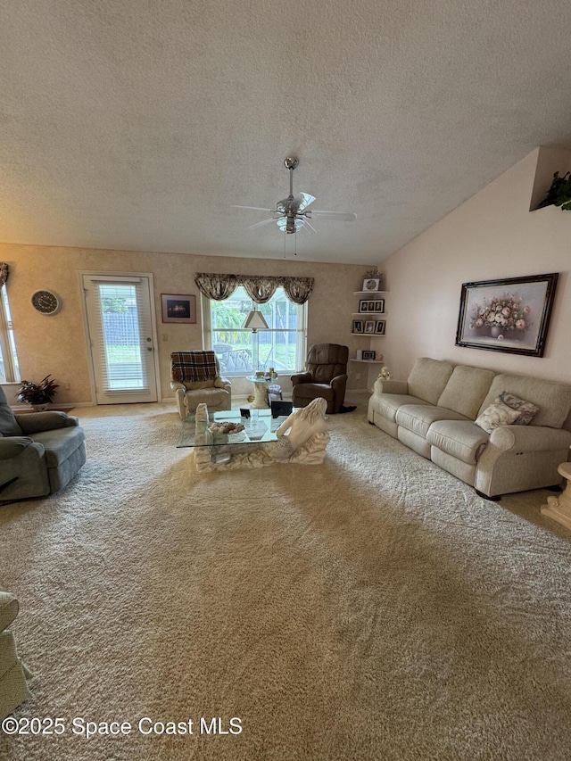 157 Lehigh Ave SE, Palm Bay, FL 32909 - carpeted living room with a textured ceiling, a ceiling fan, and plenty of natural light