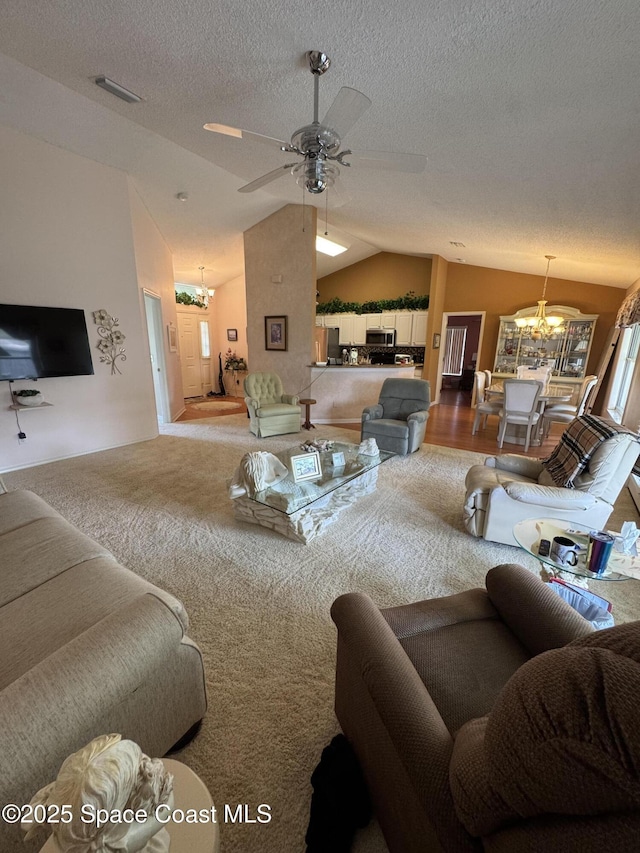 157 Lehigh Ave SE, Palm Bay, FL 32909 - living area with a chandelier, vaulted ceiling, a ceiling fan, carpet, and a textured ceiling