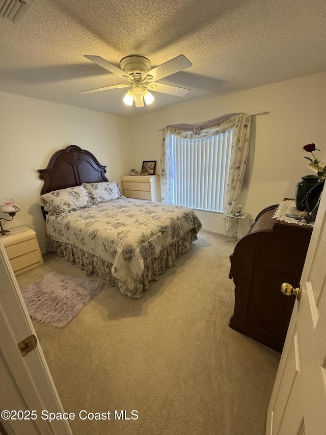 157 Lehigh Ave SE, Palm Bay, FL 32909 - carpeted bedroom featuring ceiling fan and a textured ceiling