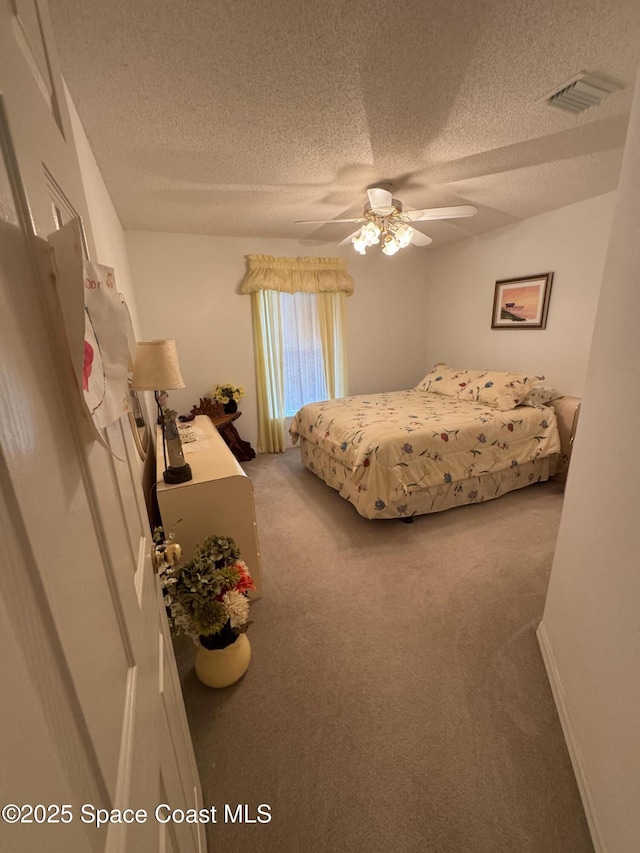 157 Lehigh Ave SE, Palm Bay, FL 32909 - bedroom featuring a textured ceiling, carpet floors, and ceiling fan