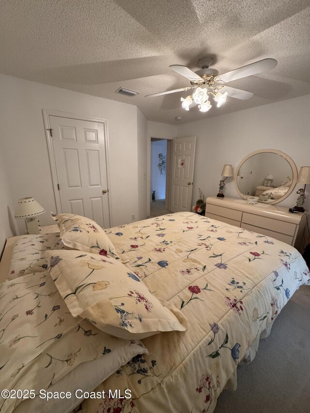 157 Lehigh Ave SE, Palm Bay, FL 32909 - carpeted bedroom featuring a textured ceiling and a ceiling fan