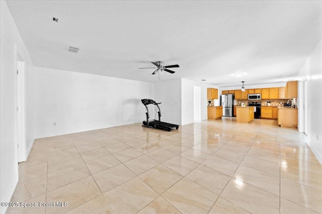 1500 La Maderia Dr SW, Palm Bay, FL 32908 - unfurnished living room with baseboards, light tile patterned floors, and ceiling fan