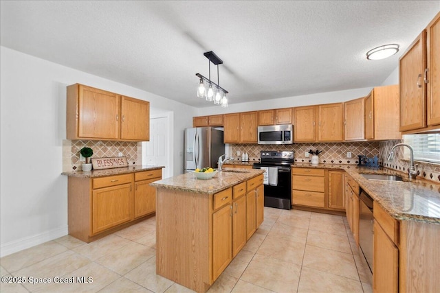 1500 La Maderia Dr SW, Palm Bay, FL 32908 - kitchen with stainless steel appliances, a sink, backsplash, light stone counters, and a textured ceiling