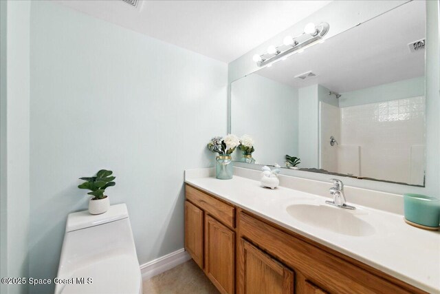 1500 La Maderia Dr SW, Palm Bay, FL 32908 - full bath with toilet, vanity, a shower, and baseboards