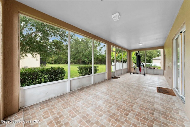 1500 La Maderia Dr SW, Palm Bay, FL 32908 - unfurnished sunroom with brick floors