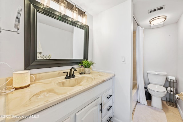 3901 Dixie Hwy NE Unit 301, Palm Bay, FL 32905 - bathroom featuring vanity, toilet, tile patterned floors, and shower / bath combo