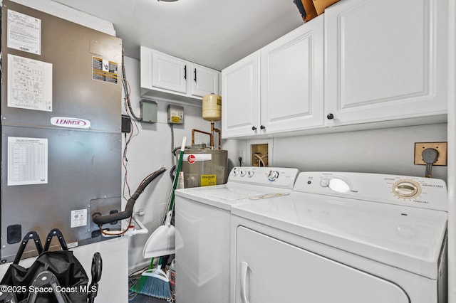 3901 Dixie Hwy NE Unit 301, Palm Bay, FL 32905 - washroom with washing machine and clothes dryer, cabinet space, water heater, and heating unit