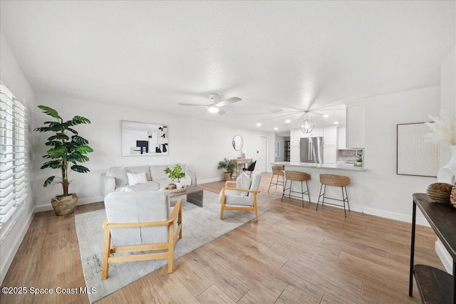 629 Verbenia Dr, Satellite Beach, FL 32937 - living area with light wood finished floors, recessed lighting, baseboards, and a ceiling fan