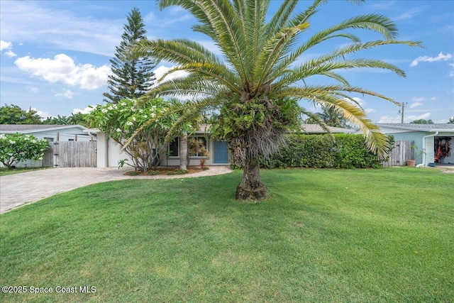 629 Verbenia Dr, Satellite Beach, FL 32937 - view of property hidden behind natural elements featuring driveway