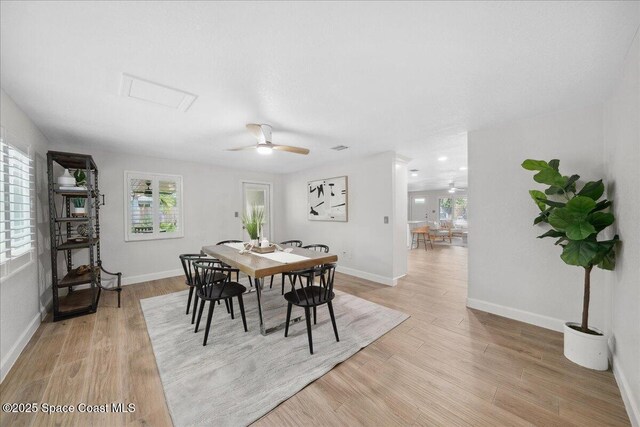 629 Verbenia Dr, Satellite Beach, FL 32937 - dining area with attic access, ceiling fan, light wood-type flooring, and baseboards