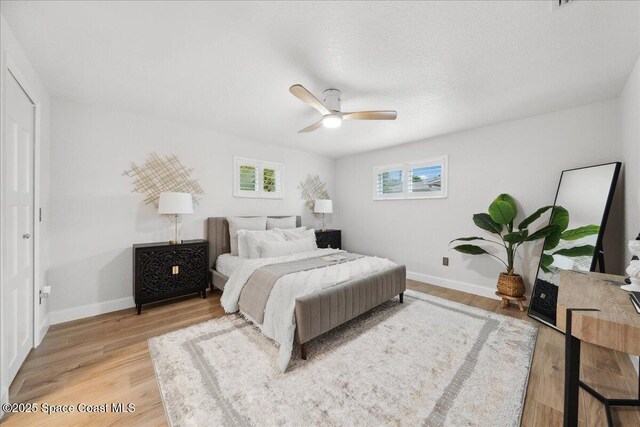 629 Verbenia Dr, Satellite Beach, FL 32937 - bedroom featuring baseboards, light wood-style flooring, and ceiling fan