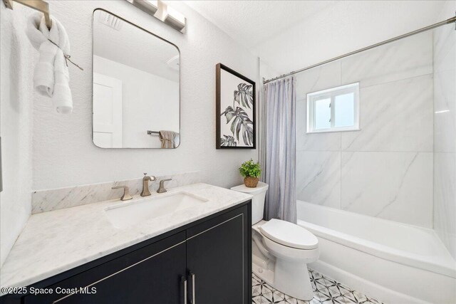 629 Verbenia Dr, Satellite Beach, FL 32937 - bathroom with vanity, toilet, and shower / bath combo with shower curtain