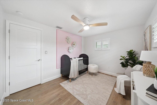 629 Verbenia Dr, Satellite Beach, FL 32937 - living area featuring baseboards, light wood-style floors, and ceiling fan