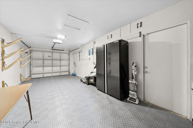629 Verbenia Dr, Satellite Beach, FL 32937 - garage featuring a garage door opener