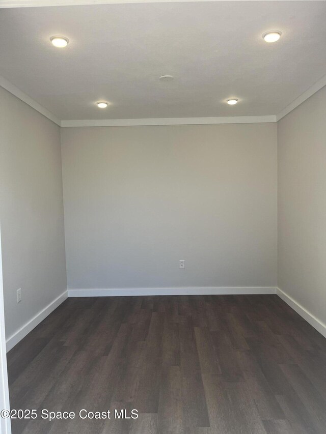 629 Verbenia Dr, Satellite Beach, FL 32937 - empty room with crown molding, dark wood finished floors, recessed lighting, and baseboards