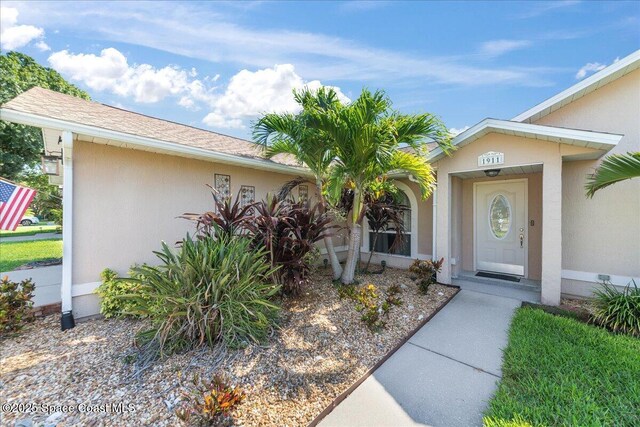 1911 Crane Creek Blvd, Melbourne, FL 32940 - property entrance with stucco siding