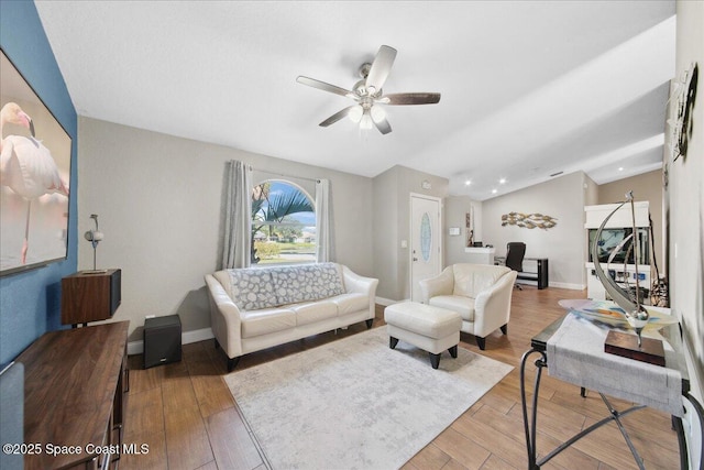 1911 Crane Creek Blvd, Melbourne, FL 32940 - living room with ceiling fan, vaulted ceiling, wood finished floors, and baseboards
