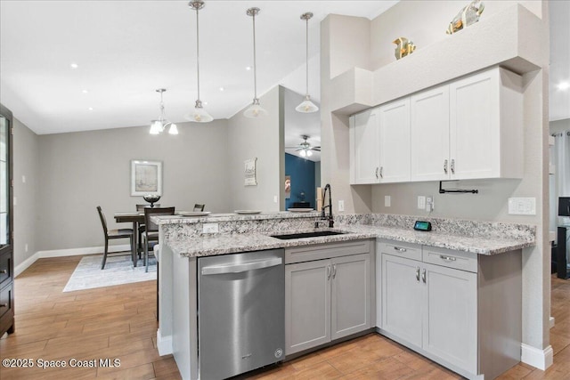 1911 Crane Creek Blvd, Melbourne, FL 32940 - kitchen with dishwasher, a sink, lofted ceiling, light wood-style flooring, and a ceiling fan