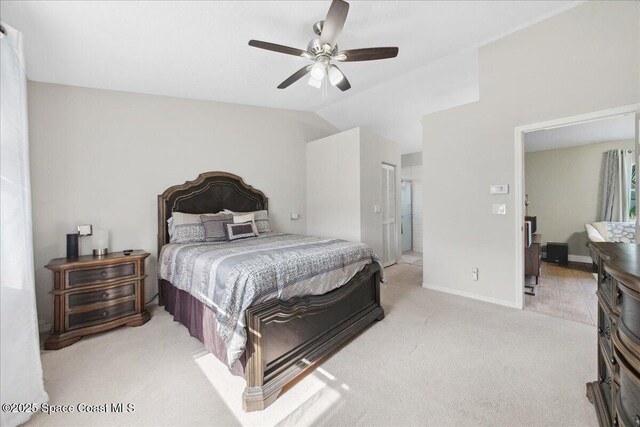 1911 Crane Creek Blvd, Melbourne, FL 32940 - carpeted bedroom with lofted ceiling, a ceiling fan, and baseboards