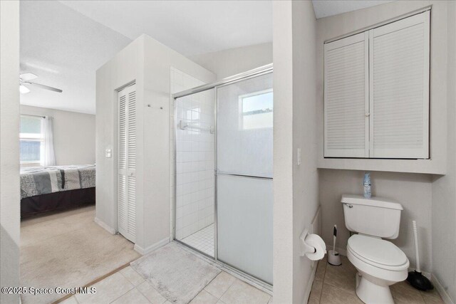1911 Crane Creek Blvd, Melbourne, FL 32940 - ensuite bathroom featuring a closet, a shower stall, and tile patterned flooring