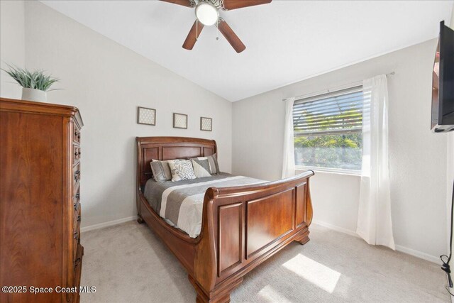 1911 Crane Creek Blvd, Melbourne, FL 32940 - bedroom featuring light carpet, baseboards, lofted ceiling, and ceiling fan