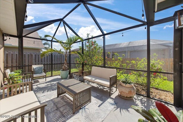 1911 Crane Creek Blvd, Melbourne, FL 32940 - fenced backyard with a patio, an outdoor living space, and a lanai